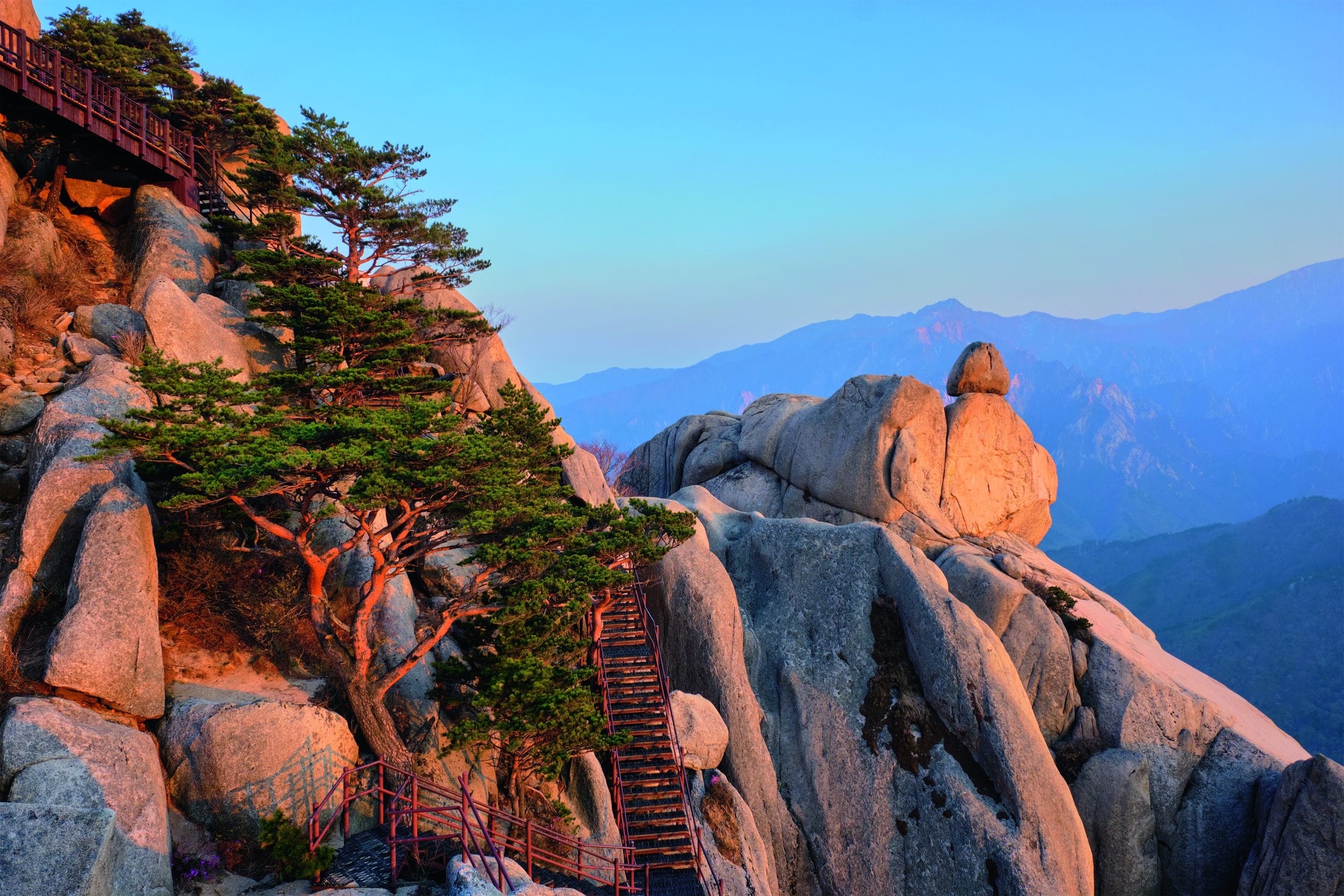 View of stones and rock formations from Ulsanbawi rock peak on sunset with staircase. Image: Getty