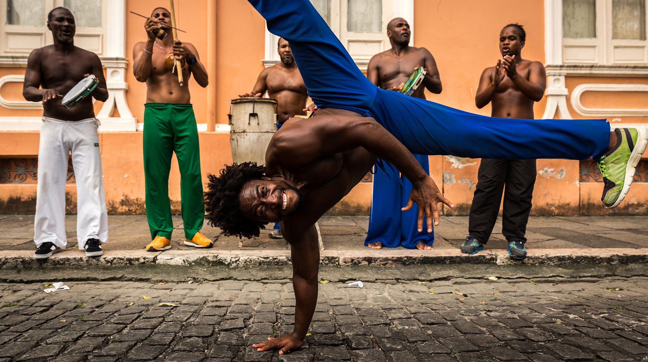Capoeira's spiritual home is the pretty port city of Salvador, whose lively beaches and squares pulse to the rhythms and beats of traditional music. Image: Getty